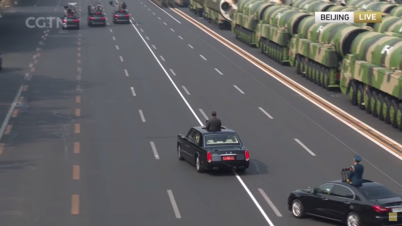 Having reached the end of the military portion of the parade, Xi circles back. Xi does not have a license plate.